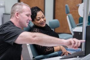Orthodontist Dr. Steve Clawson consulting with a patient at Comfort Dental Braces, discussing braces options in a modern orthodontic office setting in Federal Way, WA.